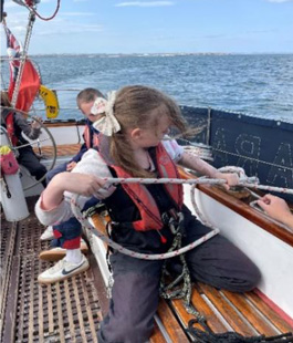 A dolphin escort for our group from Holt Youth Project